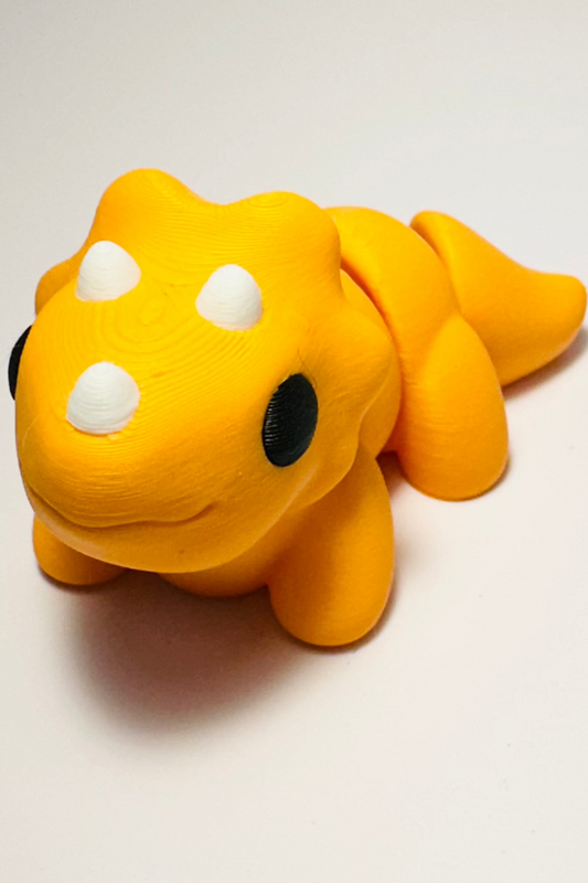 sea coastal customs triceratops dinosaur orange figure