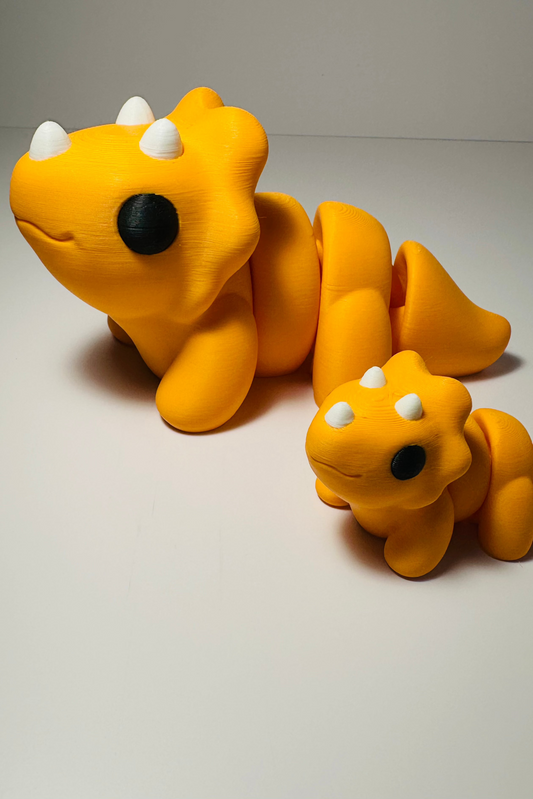 sea coastal customs triceratops dinosaur orange figures